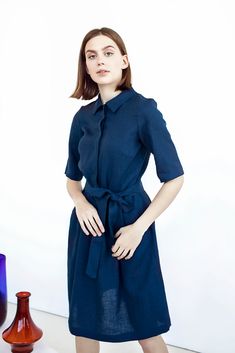 This minimalist belted linen dress is an amazing way to show off your great taste in fashion while remaining comfortable. Made from European linen, this pocketed dress is not only highly fashionable but also highly comfortable! Blue A-line Shirt Dress For Daywear, Blue Short Sleeve Mini Dress For Wedding, Elegant Blue A-line Shirt Dress, Fitted Half Sleeve Shirt Dress, Formal Fitted Linen Shirt Dress, Elegant Navy Shirt Dress For Summer, Fitted Linen Shirt Dress For Formal Occasions, Elegant Navy Shirt Dress For Spring, Blue Short Sleeve Shirt Dress For Daywear