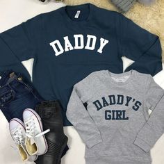 We can't even deal with the cuteness of these Daddy & Daddy's Girl father & daughter matching sweatshirts. ITEMS IN SET SOLD SEPARATELY - simply add sizes into cart separately using the drop down menu above.  Daddy & Daddy's Girl matching Classic styled sweatshirts Crew Neck College style text Ringspun cotton Wash at 30 Degrees Family Matching Long Sleeve Sweatshirt With Name Print, Family Matching Graphic Print Sweatshirt, Family Matching Long Sleeve Cotton Sweatshirt, Long Sleeve T-shirt With Letter Print For Father's Day, Father's Day Long Sleeve Letter Print T-shirt, Father's Day Long Sleeve T-shirt With Letter Print, Matching Cotton Sweatshirt For Fall, Family Matching Crew Neck Sweatshirt For Father's Day, Family Matching Long Sleeve T-shirt With Text Print