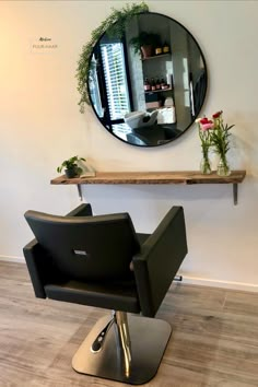 a mirror on the wall above a hair salon chair