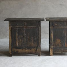 two wooden side tables sitting next to each other