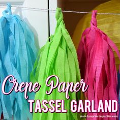 tissue paper tassel garlands hanging on a clothes line with the words crepe paper tassel garland