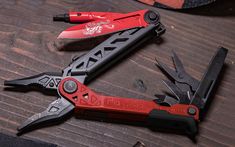 several tools are laying on a wooden table