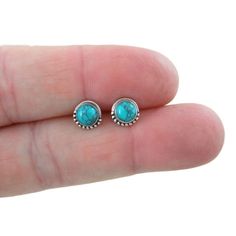 A dainty pair of everyday wear Turquoise Stud Earrings. These earrings are made of sterling silver with a 5mm Turquoise stone and about 7mm with the sterling border.  Mix and match with my other stud earrings These earrings include sterling silver butterfly backs. *Please note as with all natural gemstones the color may vary from the pair shown. This listing is for one pair of earrings Your earrings will ship in a gift box. Hypoallergenic Turquoise Earrings For Everyday, Turquoise Dainty Jewelry With Earrings Set, Everyday Turquoise Pierced Earrings, Everyday Turquoise Earrings For Pierced Ears, Everyday Turquoise Hypoallergenic Earrings, Dainty Turquoise Earrings As Gift, Dainty Turquoise Earrings For Everyday, Dainty Turquoise Earrings For Gift, Turquoise Round Birthstone Earrings