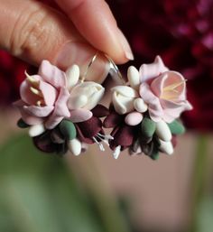 These elegant handmade earrings are crafted from polymer clay in the shape of delicate pastel flowers. Perfect for weddings, special occasions, or adding a feminine touch to your everyday style. Each petal is carefully made to capture the natural beauty of flowers. The earrings are lightweight and comfortable to wear. Treat yourself or gift these unique earrings to a loved one, and let them enhance your individuality. Pink Polymer Clay Flower Earrings For Weddings, Pink Polymer Clay Jewelry For Weddings, Pink Polymer Clay Jewelry For Wedding, Whimsical Polymer Clay Flower Jewelry, Whimsical Flower-shaped Polymer Clay Jewelry, Whimsical Flower-shaped Polymer Clay Earrings, Pink 3d Flower Polymer Clay Earrings, Pink Polymer Clay Earrings With 3d Flowers, Handmade Flower Earrings In Polymer Clay