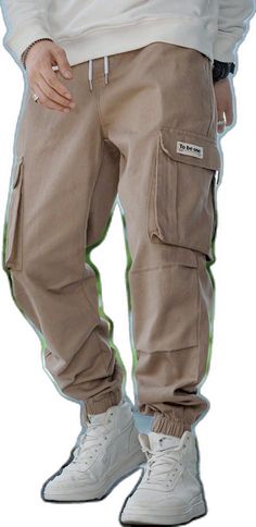 Baggy Cargo Jeans For Outdoor Casual Wear, Baggy Khaki Cargo Jeans, Cotton Drawstring Jeans For Streetwear, Baggy Cotton Cargo Jeans For Outdoor, Baggy Khaki Cotton Cargo Jeans, Hip Hop Style Cotton Cargo Jeans For Outdoor, Casual Khaki Denim Cargo Jeans, Baggy Beige Utility Cargo Jeans, Casual Beige Cargo Jeans With Multiple Pockets