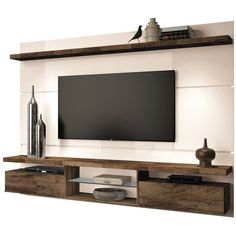 an entertainment center with a flat screen tv mounted on the wall and shelves below it