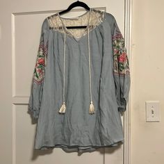 Loose Fitting And So Great To Dress Up Or Down! Beautiful Details. Made By A Great Designer Who I Own Tons Of Pieces From.., Just Getting Rid Of Ones I Don’t Wear. Size Small But Loose. Never Worn. Wrinkled From Storage. All Reasonable Offers Will Be Considered Light Blue Cotton Bohemian Dress, Blue V-neck Tunic For Spring, Light Blue Long Sleeve Dress With Floral Embroidery, Blue Long Sleeve Mini Dress With Lace Trim, Long Sleeve Blue Mini Dress With Lace Trim, Spring Blue Embroidered Mini Dress, Spring Casual Tunic With Floral Embroidery, Casual Spring Tunic With Floral Embroidery, Casual Blue Mini Dress With Floral Embroidery