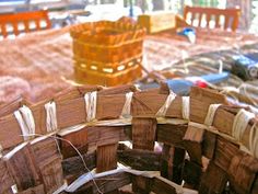 several pieces of wood sitting on top of a wooden table next to other furniture and chairs