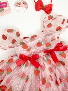 a dress made out of mesh with strawberries on it