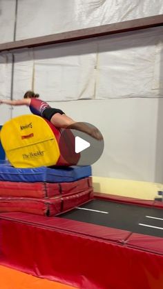 a person on a trampoline doing tricks