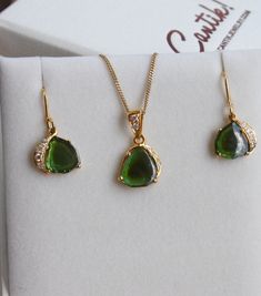 Featured in TATLER UK December 2018 issue: Unique and one of a kind, skilfully handcrafted solid 18k Gold pendant with a smooth polished deep emerald green bi-color Tourmaline slice with a darker green center, with 3 small water clear Diamonds on one side of the pendant, and 2 more Diamonds on the pendant bail. Size of the pendant without the bail and the ring is about 11 x 11 mm. Total length of the pendant from the top of the bail is about 20 mm. Please note that the chain is not included in t Tsavorite Jewelry With Gemstone Accents As Gift, Green Tourmaline Teardrop Jewelry, Formal Teardrop Tourmaline Jewelry, Formal Green Tourmaline Necklace, Handmade Yellow Gold Pear-shaped Jewelry, Pear-shaped Tourmaline Jewelry As A Gift, Pear-shaped Tourmaline Jewelry For Gift, Pear-shaped Tourmaline Jewelry Gift, Handmade Pear-shaped Yellow Gold Jewelry