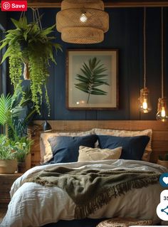 a bedroom with blue walls and plants hanging from the ceiling, along with a bed