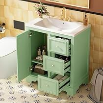 a bathroom with a sink and green cabinet