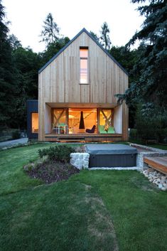 a small house with a hot tub in the yard