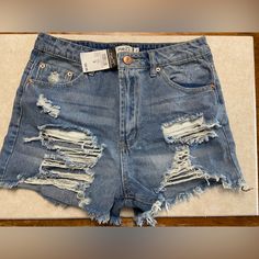 Distressed Jean Shorts From Rue21 Size 5, New With Tags. Trendy Distressed Short Bottoms, Ripped Light Wash Shorts, Summer Ripped High-waisted Shorts Jeans, High Waist Distressed Summer Shorts, Light Wash Ripped Short-leg Bottoms, Ripped Blue Short Bottoms, Blue Ripped Short Bottoms, Trendy Distressed Short Leg Bottoms, Summer Ripped Cutoff Bottoms