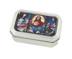 a small tin with an image of jesus on it