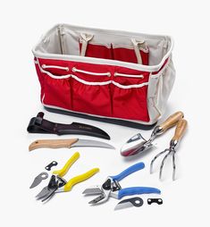 a red bag filled with lots of different tools