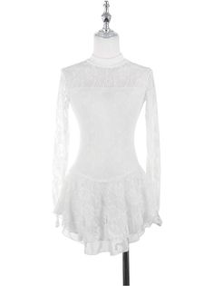 a white top on a mannequin dummy with long sleeves and ruffles