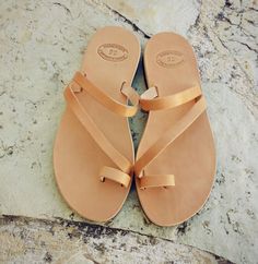 ♥ A pair of high quality,100% genuine Greek leather sandals ♥ You can wear them all day, they are very comfortable ♥ Perfect for everyday adventures, beach, bridal If you take half size, go UP to the nearest whole size. Ladies shoe sizes EU3536373839404142 UK23-3.54566.578 USA4.5567891011 cm23.123.824.425.125.826.527.2....27.8 inches__9.19.39.69.910.1510.410.710.9 YOU CAN FIND MORE THAN 90 SANDAL DESIGNS IN MY SHOP: https://www.etsy.com/shop/GrecianSandals?ref=hdr_shop_menu The sizes up to sanda Leather Toe Loop Flip Flops For Summer, Summer Toe Loop Barefoot Sandals With Leather Footbed, Summer Leather Toe Ring Sandals With Toe Loop, Leather Toe Loop Sandals For Summer, Leather Sandals With Single Toe Strap, Leather Sandals With Single Toe Strap For Summer, Womens Leather Sandals, Sandals With Straps, Flat Leather Sandals