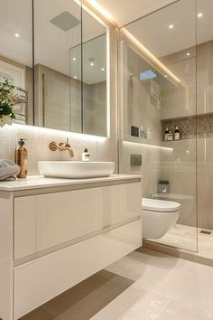 a bathroom with a sink, toilet and shower stall in the background is illuminated by lights