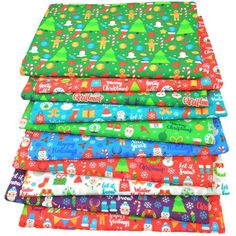 six different colored christmas wrappings stacked on top of each other