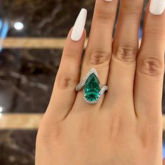 SKU#: OB875RG*Handmade to order. Please allow 3-5 business days before shipment.Primary StoneStone Type: Lab-Created GemstoneStone Cut: Pear CutStone Color: Paraiba TourmalineStone Weight: 12 CT.Stone Size: 10*15mmSide StoneStone Shape: Round CutStone Color: WhiteStone Weight: 1.0 CT.Setting InformationMetal Type: 925 Sterling SilverPlating Color: Silver Tone*Customized service of this item is available, please contact our customer service to place orders. Please notice that: the change of the s Paraiba Tourmaline Engagement Ring, Emerald Ring Design, Big Engagement Rings, Pear Wedding Ring, Tourmaline Engagement Ring, Silver Engagement Ring, Stackable Wedding Bands, Pear Shaped Engagement Rings, Engagement Rings Affordable