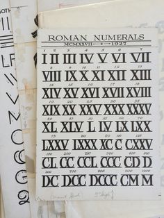 some old roman numerals are stacked on top of each other in order to read them