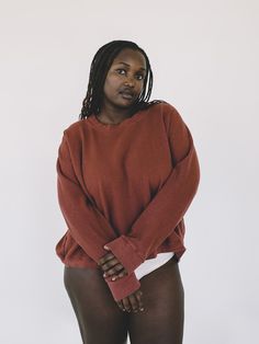 Cropped sweatshirt with no shoulder seams in an organic cotton/hemp blend. Hits slightly above natural waist. Locally dyed. Produced in a family-owned factory in the Bay Area. Mekdela is 5'8" and wears a S. Chest: 34." Mercy is 5'5" and wears a 2X. Chest: 40." S-3X. True to size, recommend sizing up for more relaxed fit. See Sizing Chart 55% Hemp, 45% Organic Cotton Machine Wash Cold. Dry Flat or Tumble Dry Low. No Bleach. The Bay Area, Cropped Sweatshirt, Crop Sweatshirt, Sizing Chart, Bay Area, Bleach, Organic Cotton, Dye, Relaxed Fit