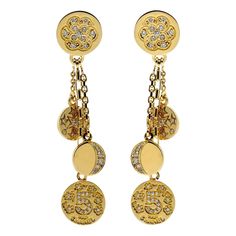 A magnificent pair of Chanel earrings featuring a diamond-encrusted iconic motifs set in 18k yellow gold. Length: 2.44″ Inches Inventory ID: 0000051 Chanel Charm, Chanel Yellow, Vintage Chanel Jewelry, Diamond Gold Earrings, Chanel Jewelry Earrings, Chanel Camellia, Chanel Couture, Yellow Gold Earrings, Chanel Earrings