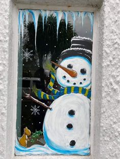 a snowman is painted on the side of a building