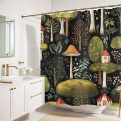 a bathroom with a shower curtain that has trees and mushrooms on it