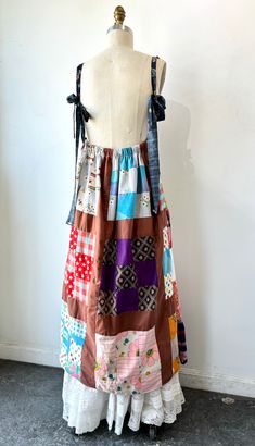 Gorgeous vintage handmade patchwork maxi dress Beautiful colors on this one! Free flowing fit with high waist and pinafore style bust. Cotton lined, mostly cotton material with some cotton/poly blend patchwork. Unique vintage fabrics with assorted prints and cute elephant details. Perfect piece for layering with a white blouse underneath. Shown styled with a white Victorian maxi skirt Best fits size medium. Can fit small-large, waistband has some stretch. Approx. Measurements Stretchy empire wai Brown Cotton Patchwork Dress, Bohemian Maxi Dress For Picnic, Multicolor Cotton Square Neck Dress, Multicolor Cotton Dress With Square Neck, Multicolor Square Neck Cotton Dress, Hippie Cotton Dresses With Floral Patchwork, Bohemian Brown Dress With Patchwork, Multicolor Cotton Patchwork Dress, Cotton Maxi Dress For Picnic