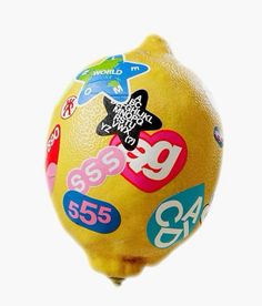 a close up of a lemon with stickers on it's side and numbers