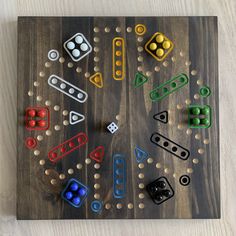 a wooden board game with dices and dominos on it