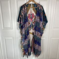 Great Condition, No Stains, Holes, Or Flaws. Pit To Pit 36 Inches. Length From Shoulder To Hem 45 Inches. Multicolor Spring Kaftan With Back Tassel Tie-up, Spring Multicolor Kaftan With Tassels, Bohemian Multicolor Kaftan With Back Tassel Tie-up, Bohemian Festival Kimono With Tassel Ties, Bohemian Festival Kaftan With Tassel Ties, Bohemian Kaftan With Tassel Ties For Festival, Multicolor Kimono With Tassel Details, Blue Bohemian Kimono With Boho Print, Multicolor Kimono With Tassels