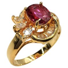 Introducing our Vintage Vivid Red Oval Cut Ruby & Mixed Cut Diamond Ring in 20K Yellow Gold, a truly exquisite piece that captures the allure of vintage glamour. This stunning ring features a vivid red oval cut ruby of approximately 1.20 carats, embraced by a dazzling array of diamonds. At the center of attention is a captivating oval cut ruby, radiating with intense red color and natural beauty. Its vivid hue and excellent clarity make it the focal point of the design, exuding elegance and soph Glamour Vintage, Marquise Cut Diamond, Baguette Cut Diamond, Vintage Glamour, Belleza Natural, Round Cut Diamond, Exquisite Design, Cocktail Rings, Oval Cut