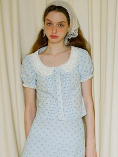 This product, the Cest Petite Heart Shirring Shirt, exudes a delicate and charming vibe perfect for romantic and vintage-inspired looks. The shirt features intricate shirring and a peter pan collar, adding a touch of classic femininity. It’s designed to be paired effortlessly with skirts or trousers for versatile styling options. - This shirring shirt is adorned with petite heart patterns, offering a sweet and delicate touch.- The peter pan collar with lace trim enhances the vintage appeal of the shirt.- Puff sleeves add a whimsical and feminine silhouette.- The lightweight and breathable fabric ensures comfort throughout the day.- A handmade Cali medal decoration has been attached to the lower right side of the front panel to add a unique point of interest. Barbie Life, Prom Dress Inspiration, Feminine Silhouette, Dress Inspiration, Pan Collar, Peter Pan Collar, Heart Patterns, Fashion Tops, Dream Wardrobe