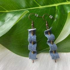 the earrings are made out of blue fabric