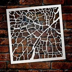 a paper cut out of a map on a brick wall