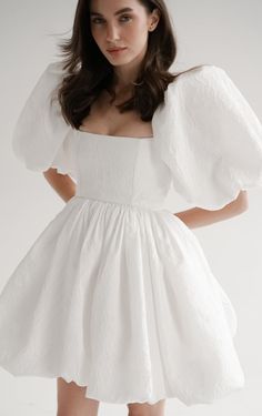 Short wedding dress crafted from textured taffeta, this gown features charming puff sleeves and a playful balloon skirt, exuding whimsical grace and modern elegance for your special celebration. Puff Wedding Dress, Wedding Dress Elopement, Wedding Dress Crafts, Light Feminine, Balloon Skirt, Exquisite Gowns, Elopement Dress, Bridal Shower Dress, Art Dress