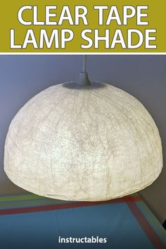 a white lamp shade with the words clear tape lamp shade on it and an image of a