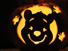 a carved pumpkin with an animal face on it