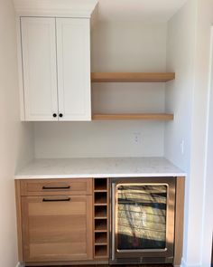 a kitchen with an oven and cabinets in it