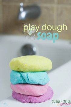 a pile of colorful play dough sitting on top of a bath tub