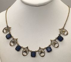 "Beautiful antique victorian Art Deco gold filled with royal blue sapphire necklace cute and dainty good pre-owned condition measures 16\" length." Blue Medieval Necklace, Antique Sapphire Necklace, Antique Blue Necklaces For Formal Occasions, Blue Victorian Jewelry With Vintage Charm, Blue Victorian Necklace For Formal Occasions, Victorian Blue Necklaces For Formal Occasions, Victorian Style Blue Necklaces For Formal Occasions, Antique Blue Necklace With Vintage Charm, Antique Blue Necklaces With Vintage Charm