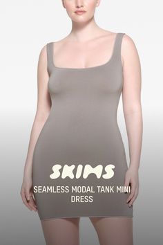 A boost to your comfort and curves. This hot mini dress flatters your figure with its super stretchy fabric and fitted silhouette. Feels ultra-soft and lightweight for indoor and outdoor comfort on warmer days. Features chic tonal edges at the wide scoop neck, armholes, and hem. Fits true to size. | SKIMS Tank Mini Dress | Grey | 4X/5X | Seamless Modal