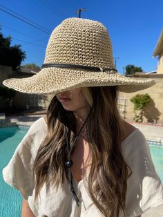 Hot item! This beautiful, floppy straw hat is fashionable and stylish!  It will compliment every outfit. This hat features a leather chin strap that is adjustable to hold your hat in place, even on windy days.  It's lightweight, foldable, and easy to pack for travel.  The brim wiring allows you to shape it anyway you'd like.  The unique woven structure allows air to flow inside the hat, keeping you cool on hot summer days.  It comes with an adjustable band inside to fit most crown sizes (fits up to circumference of 22 inches).  Brim measure: 4 inches wide.  * Special note to buyers : If you require the crown to be a little bit on the smaller or larger side, please contact me as I do have a few hats that run a bit smaller and bigger than the standard size (very limited).  * Hat comes in 2 p Women Straw Hat, Garden Hat, Woven Structure, Packing Folding, Floppy Straw Hat, Gardening Hat, Straw Hat Beach, Boho Hat, Sun Hats For Women