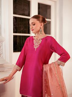 Elevate your style with this intriguing and elegant hot pink silhouette. The ensemble features exquisite embroidered details on the neckline, sleeves and bottom with shade of pink, adding a touch of sophistication and charm. Paired with a contrast organza dupatta, this outfit effortlessly enhances your look, making it perfect for any occasion where you want to make a stylish and memorable impression. Shirt: Raw SilkPants: Raw SilkDupatta: Organza Pink Silhouette, Zainab Chottani, Dressy Clothes, Shade Of Pink, Organza Dupatta, Embroidered Details, How To Iron Clothes, Silk Dupatta, Silk Pants