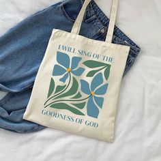 This Christian canvas tote bag features "I will sing of the goodness of God," and is a great way to share your faith! It makes the perfect gift for a Christian musician or worship leader. This 100% cotton bag comes in one size - 15" x 16"- perfect for everyday wear. The canvas material displays the design beautifully, but is also durable and will last for years. The bag features 20" handles (made from the same canvas), making it easy to carry even with a week's worth of shopping. We do not accep