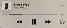 an electronic device with the words those eyes, new west and headphones on it